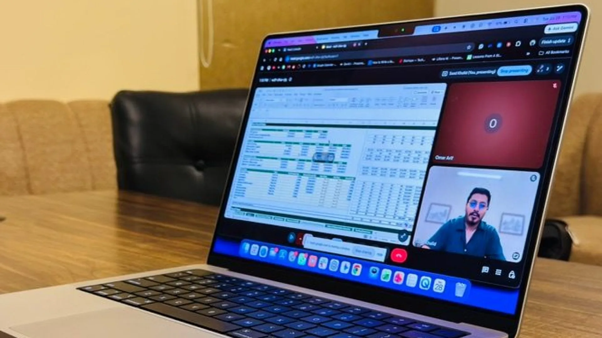 A partner mid-call with a financial model open on screen
